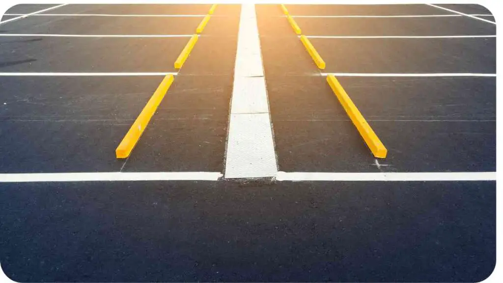 an empty parking lot with yellow lines