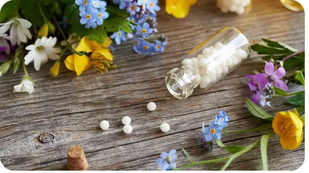 flowers and pills on a wooden table