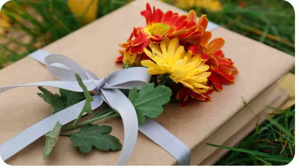 a gift wrapped in brown paper and tied with a ribbon on the grass