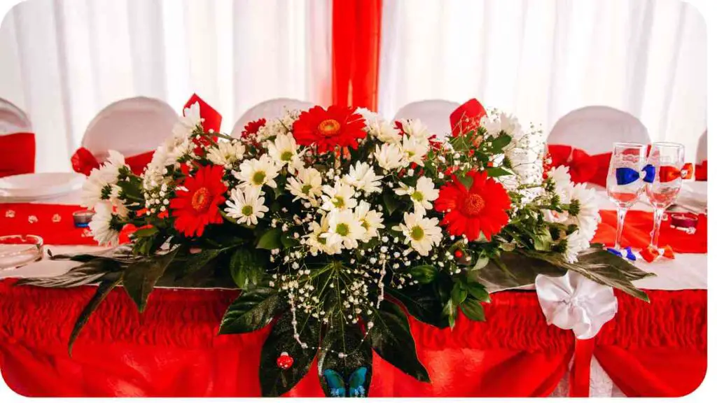 a table covered in red and white flowers