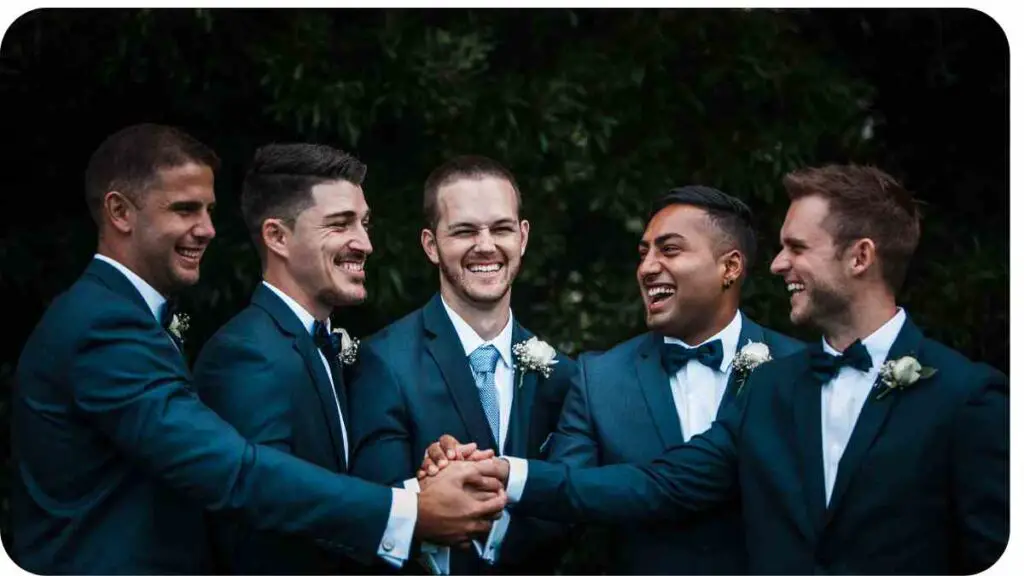 a group of individuals in suits holding hands