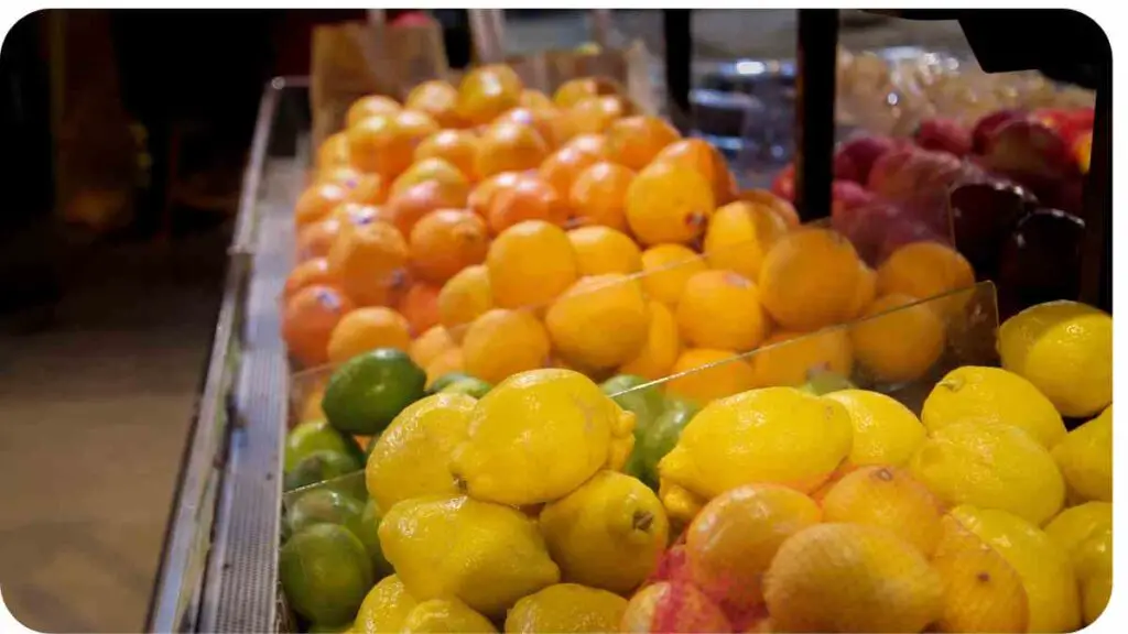 various types of fruits and vegetables are on display in a grocery store