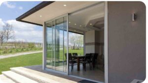 a patio with glass doors and patio furniture