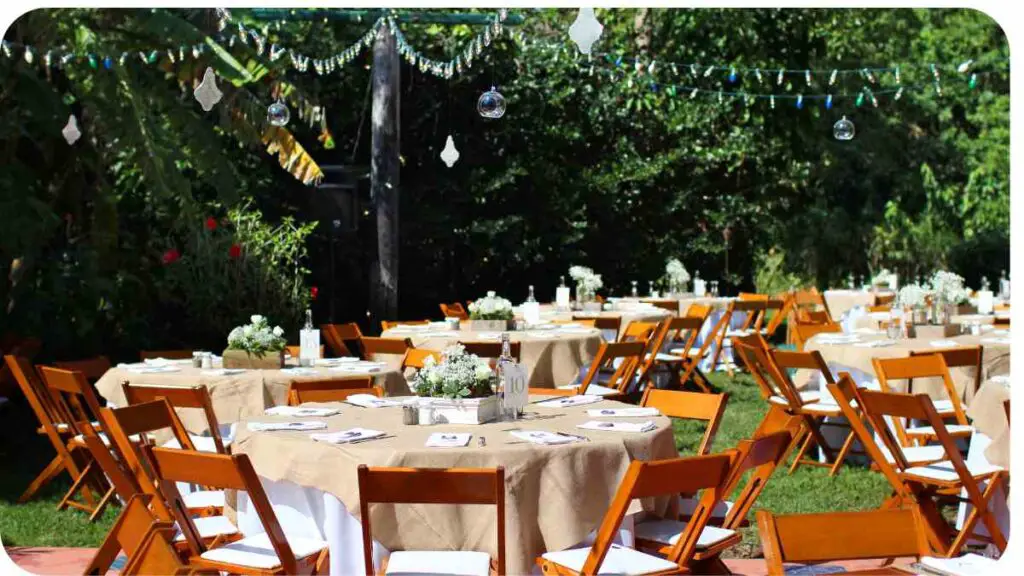 an outdoor wedding reception with tables and chairs